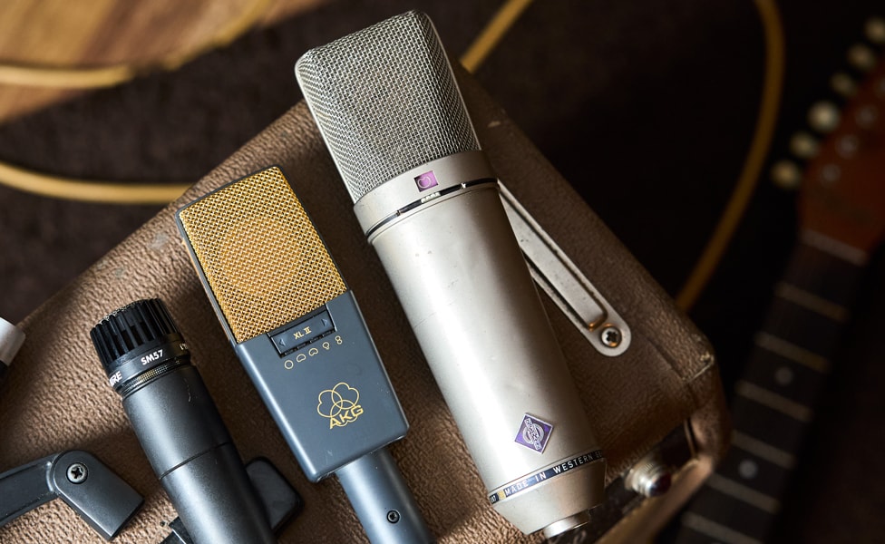 Shure SM57, AKG C414 XLII and Neumann U 87 Ai on top of guitar amp