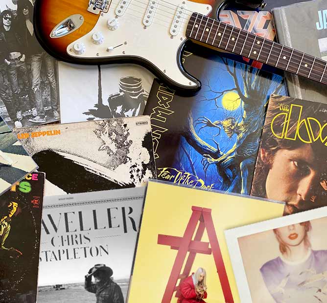 Collection of music records with a guitar.