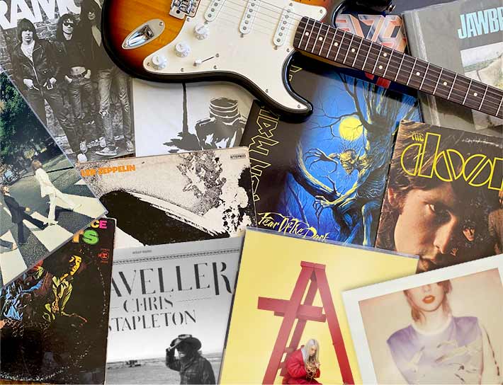 Collection of music records with a guitar.