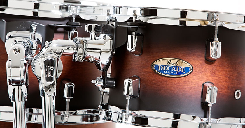 Rack tom featuring Pearl mini lugs, triple-flange hoops, Uni-Lock gearless tom arm and bass drum suspension mount