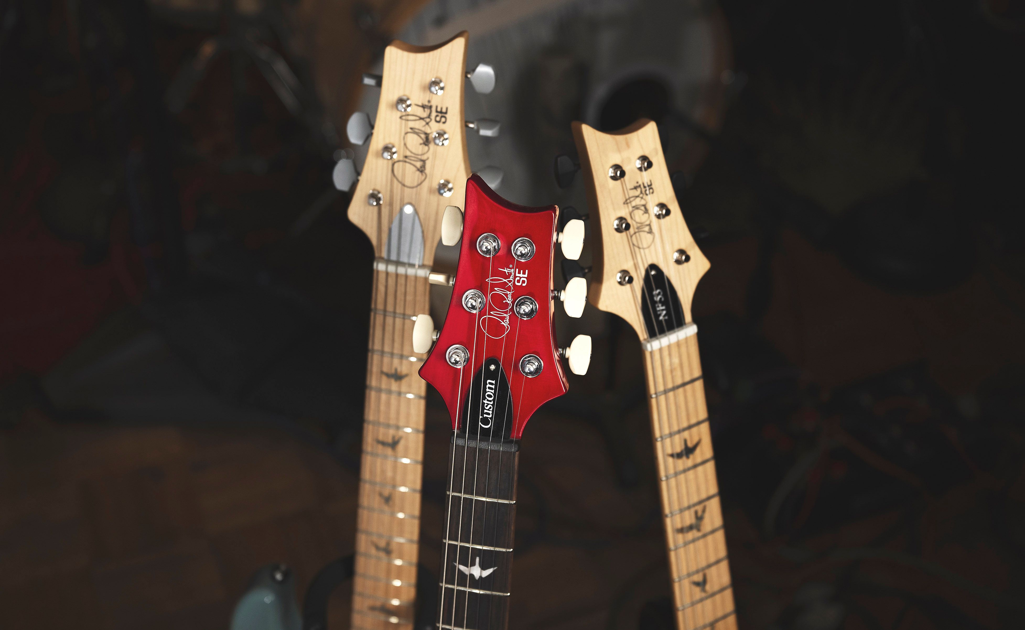 PRS_SE_Guitars_Headstock_Group_Shot_Inline.jpg