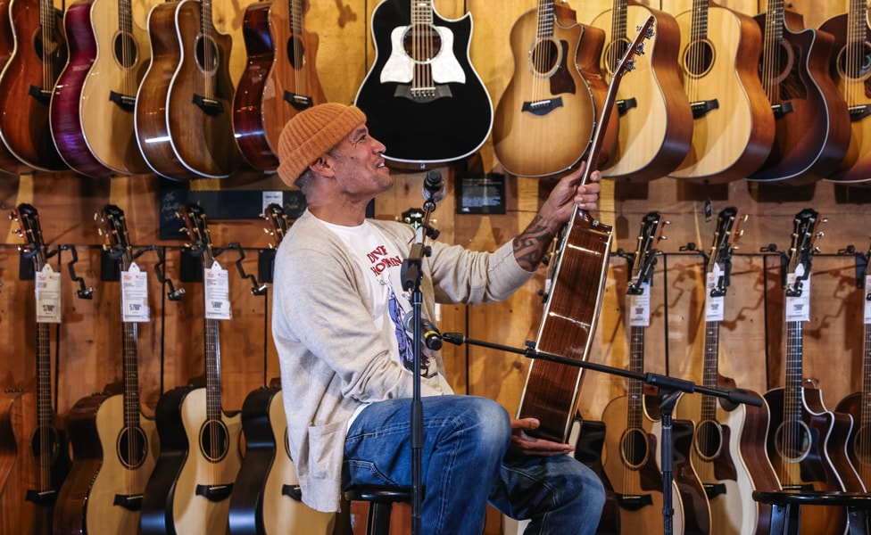 Ben Harper Admiring the "First" Taylor 810 Acoustic Guitar