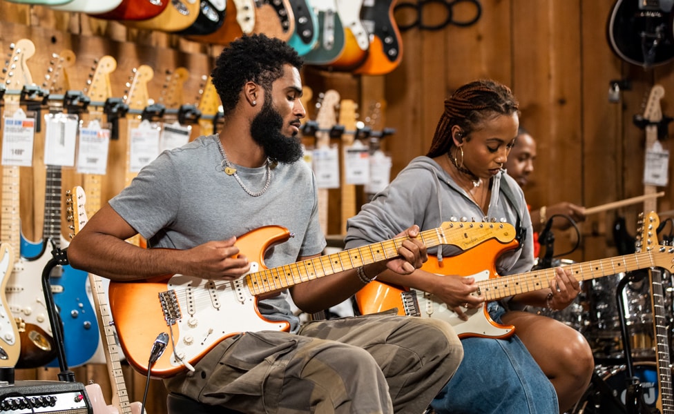 Freaky Rob Gueringer and Ari O'Neal Playing Fender Stratocasters in Candy Melon at Guitar Center Hollywood