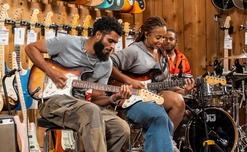 "Freaky" Rob Gueringer and Ari O'Neal playing sunburst Fender Stratocasters at Guitar Center Hollywood