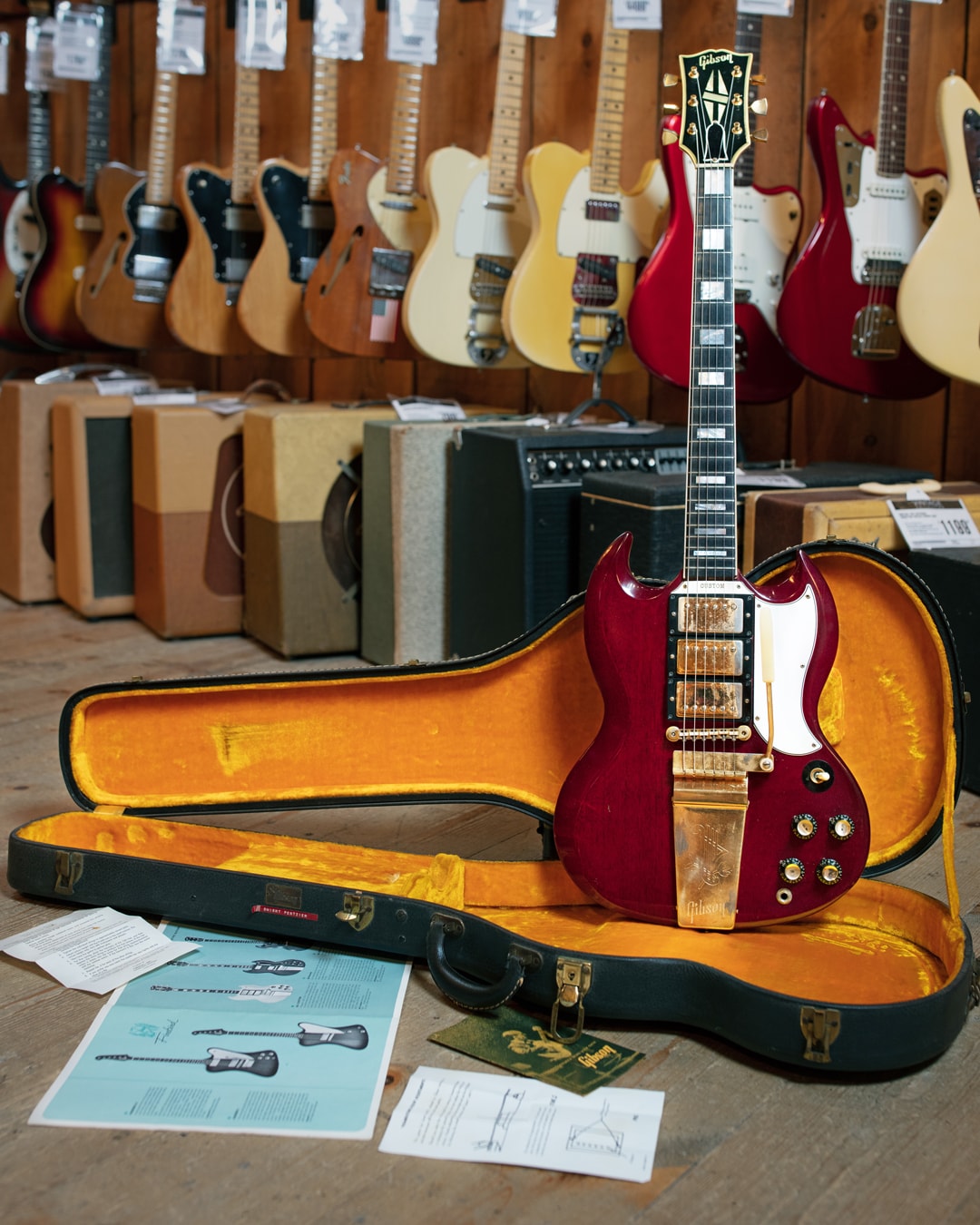 Full body photograph of 1963 Gibson SG Custom Cherry