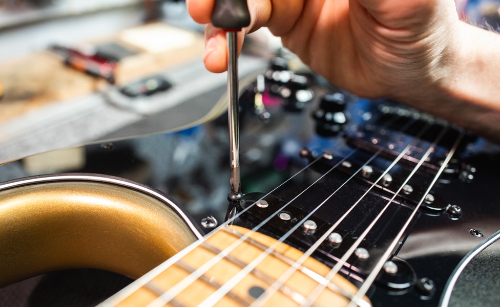 A Fender Stratocaster Pickup's Height Being Adjusted