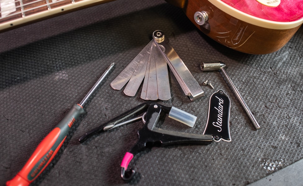 Various tools for adjusting a guitar's truss rod