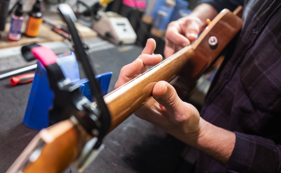 Fretting a guitar with a capo while doing truss rod adjustments