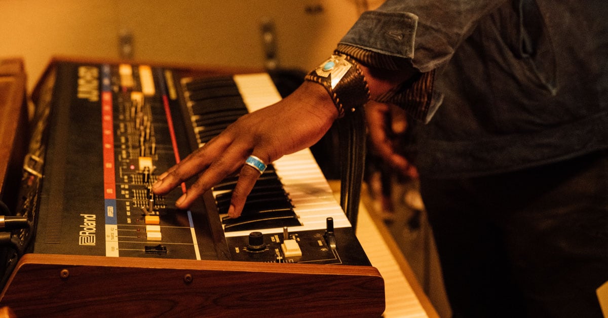 Eric Burton playing a Roland Juno-60