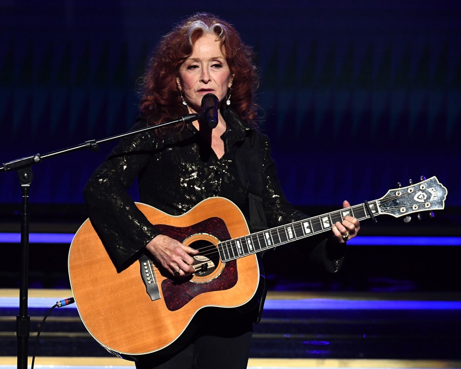 Bonnie Raitt performs with her Guild F-50 acoustic guitar at the 62nd GRAMMY Awards