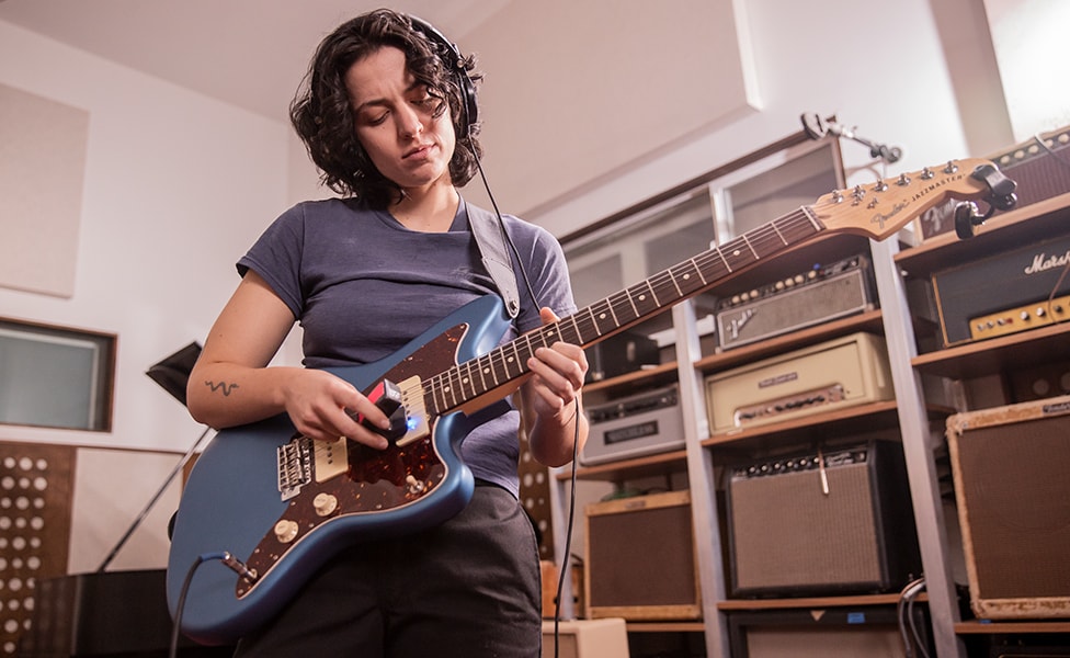 Josette playing the guitar