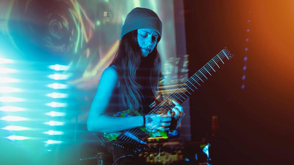 Sarah Longfield with her signature Strandberg Guitar