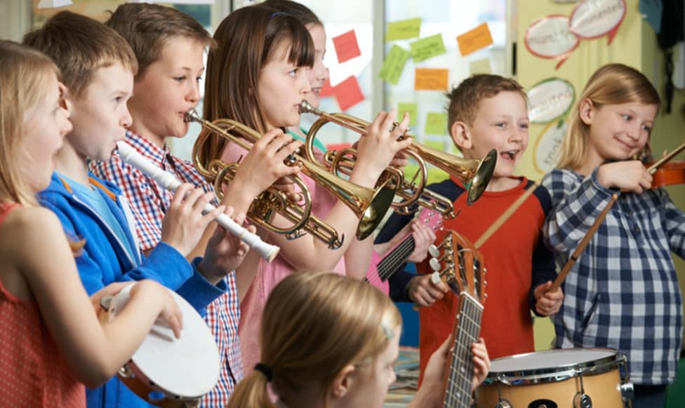 Kids playing musical instruments in school