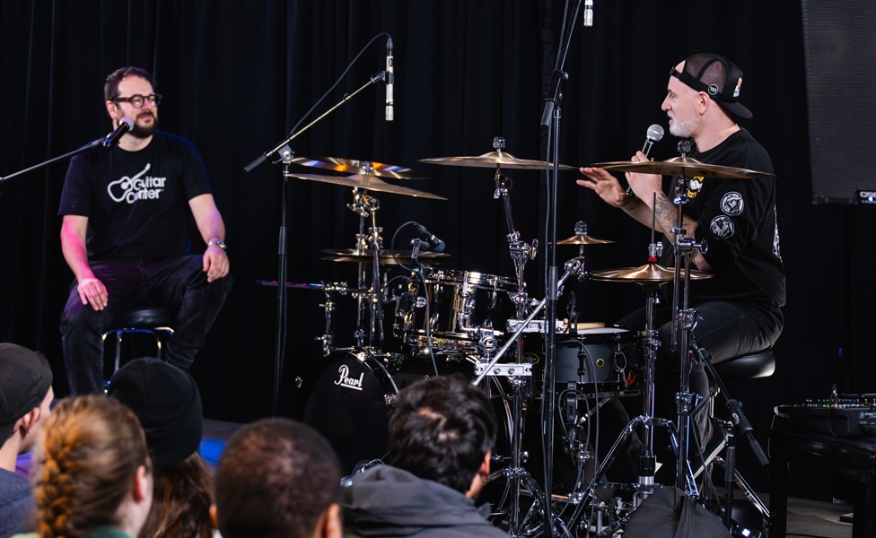 Matt Halpern answering questions on stage at GC Hollywood with Guitar Center's Dustin Hackworth