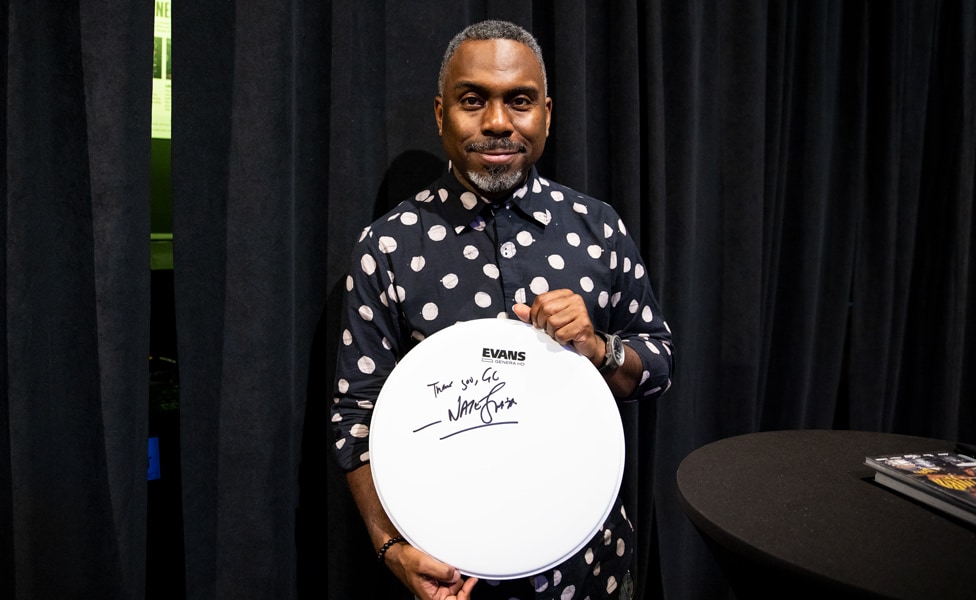 Nate Smith with a Signed Drum Head at Guitar Center Hollywood