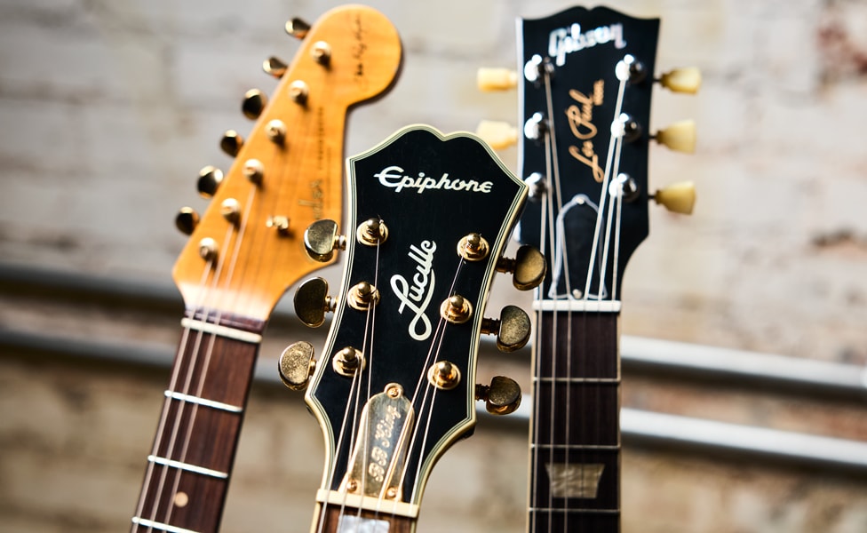 Headstocks Left to Right: Fender Custom Shop Stevie Ray Vaughan Signature Stratocaster, Epiphone BB King Lucille and Gibson Warren Haynes Les Paul Standard