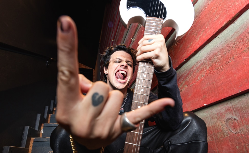 YUNGBLUD throws up the horns with his signature Epiphone SG Junior