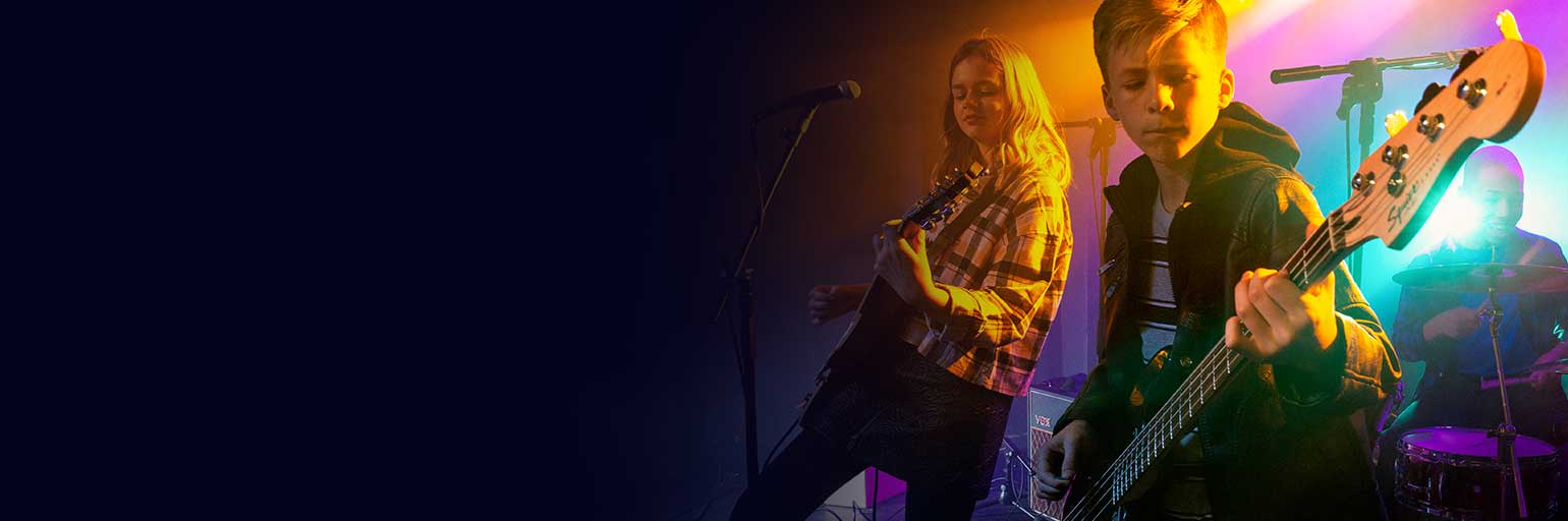 Young girl playing guitar.