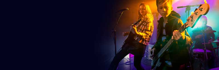 Young girl playing guitar.