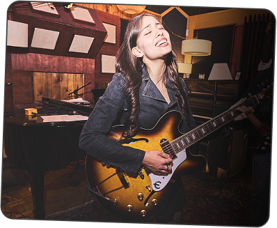 Instructor holding guitar