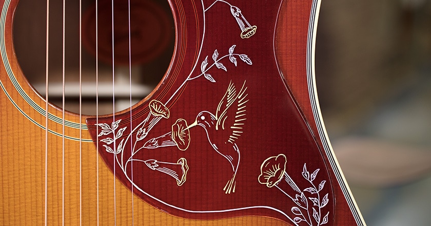 Up-close soundhole and pickguard view of 2019 Hummingbird Vintage Series, L.R. Baggs VTC