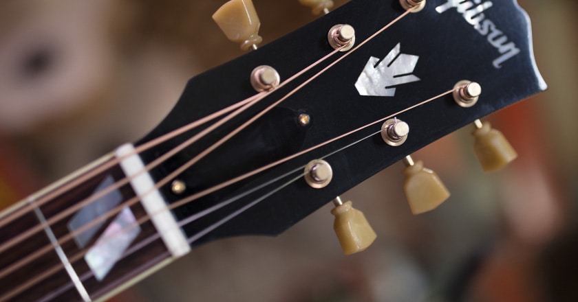 Headstock view of J-185 Vintage Series guitar, relic vintage-style tuners