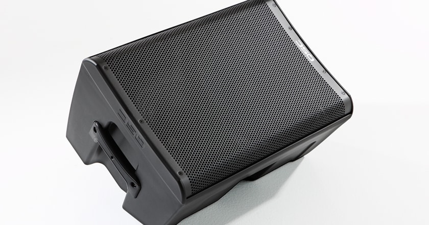 QSC CP12 speaker laying on its side as a floor monitor
