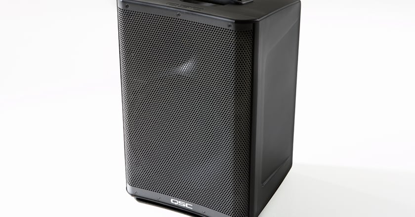 Front view of QSC CP8 speaker standing upright